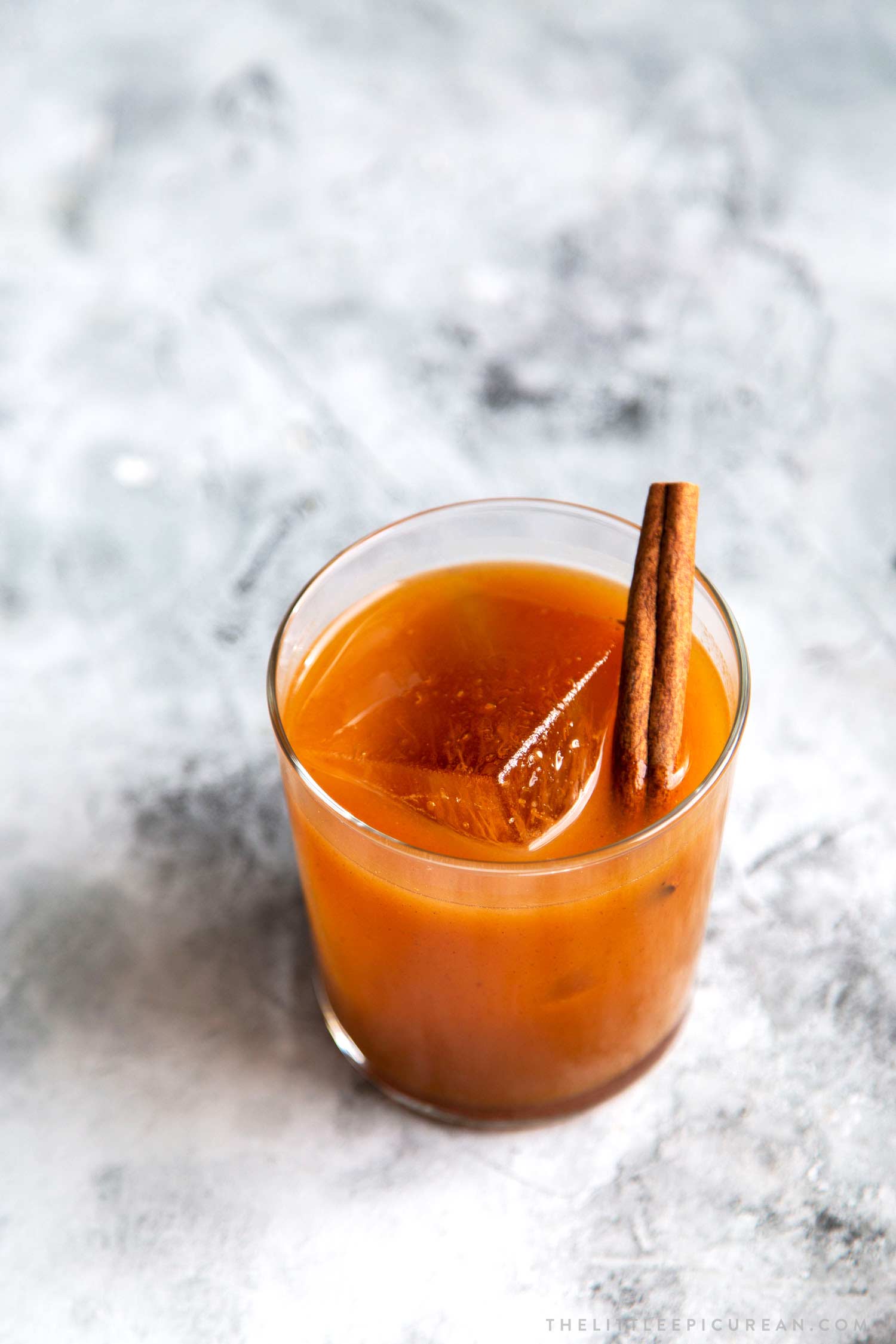 Garnish Pumpkin Bourbon Cocktail (autumn harvest cocktail) with a cinnamon stick.