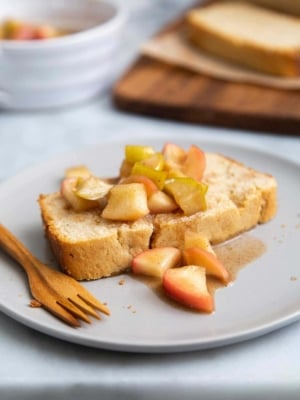 Spiced Apple Pound Cake. Orange scented pound cake topped with cooked spiced apples. #dessert #poundcake #recipe #appledessert