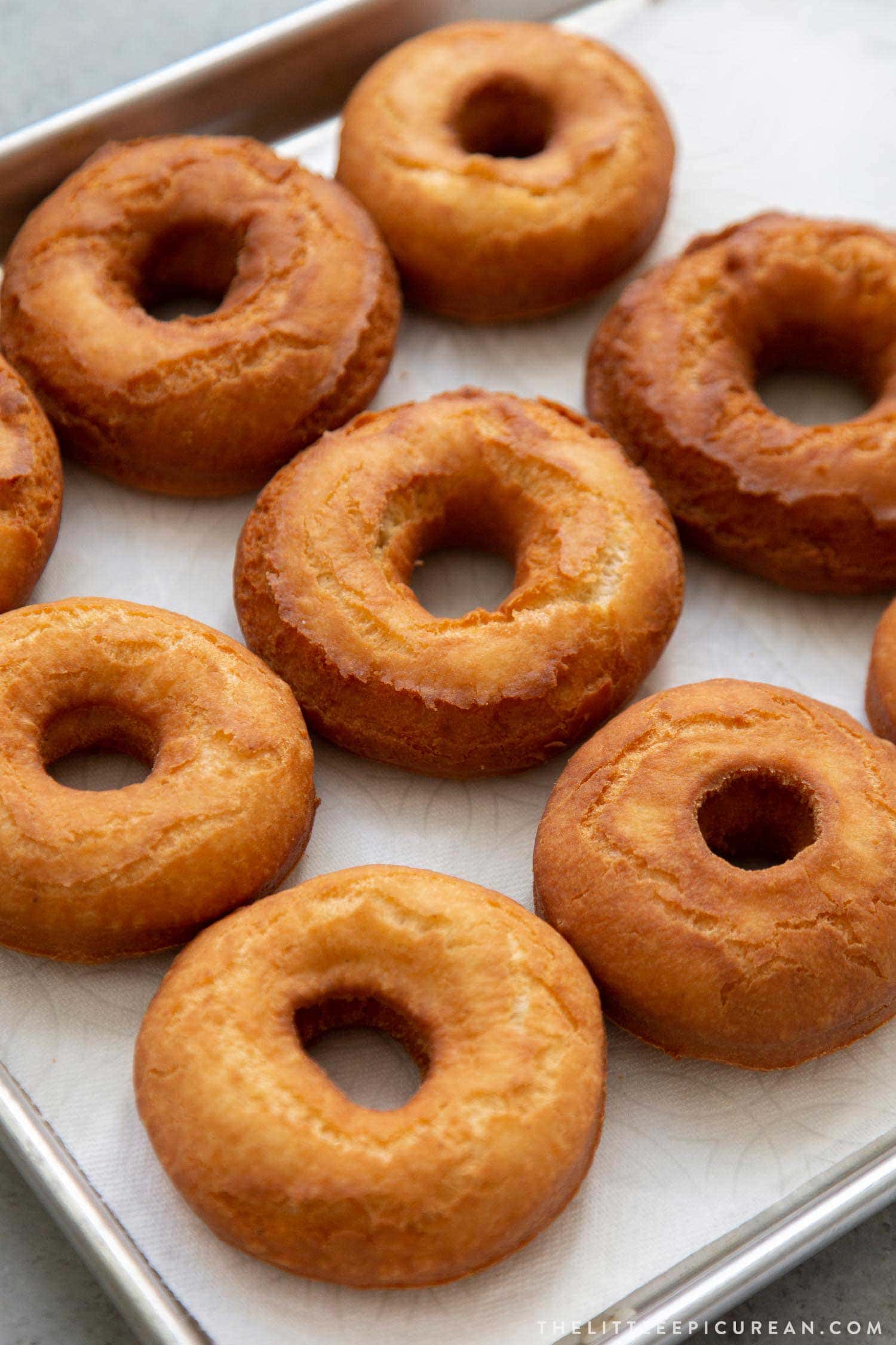 Fried old fashioned donuts before glaze.