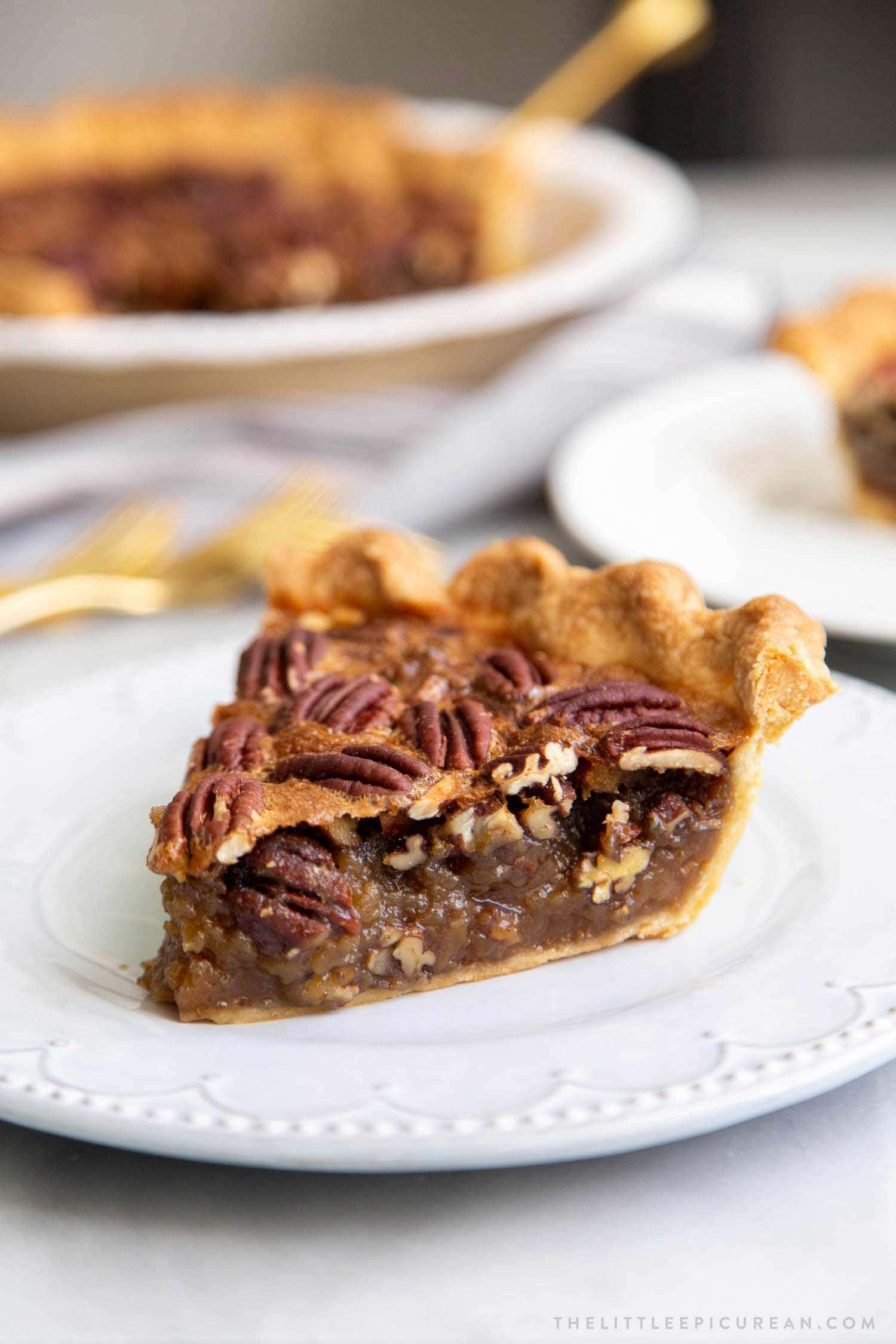 Brown Butter Pecan Pie. Traditional pecan pie with the added warmth and nuttiness of brown butter. This recipe includes a homemade butter pie crust. Perfect for Thanksgiving and beyond! #pecanpie #pie #classicpie #recipe #thanksgiving #holidays #fallbaking