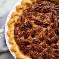 Brown Butter Pecan Pie. Traditional pecan pie with the added warmth and nuttiness of brown butter. This recipe includes a homemade butter pie crust. Perfect for Thanksgiving and beyond! #pecanpie #pie #classicpie #recipe #thanksgiving #holidays #fallbaking