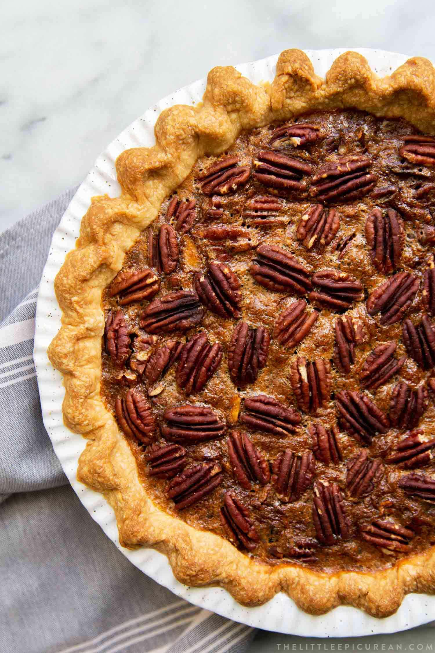 Brown Butter Pecan Pie. Traditional pecan pie with the added warmth and nuttiness of brown butter. This recipe includes a homemade butter pie crust. Perfect for Thanksgiving and beyond! #pecanpie #pie #classicpie #recipe #thanksgiving #holidays #fallbaking