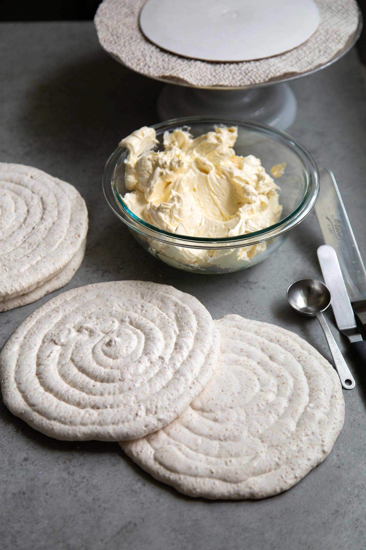 Sans Rival (Filipino cashew dacquoise cake) assembly.