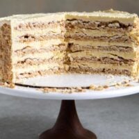 Interior shot of Sans Rival Cake. Filipino cake consisting of cashew dacquoise layered with French buttercream. #cake #dessert #glutenfree #cashews #buttercream #filipino #filipinodesserts #filipinorecipes