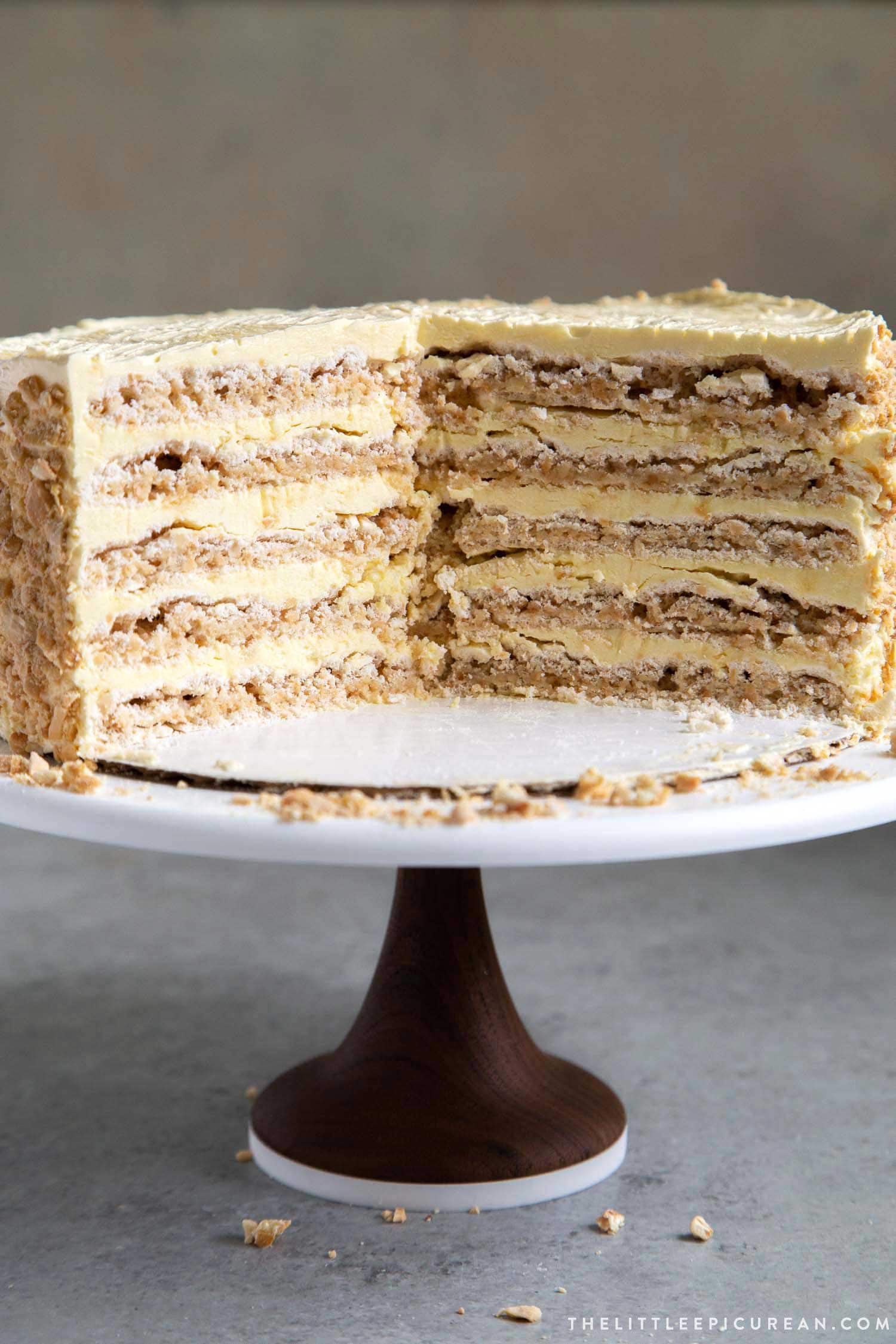 Interior shot of Sans Rival Cake. Filipino cake consisting of cashew dacquoise layered with French buttercream. #cake #dessert #glutenfree #cashews #buttercream #filipino #filipinodesserts #filipinorecipes