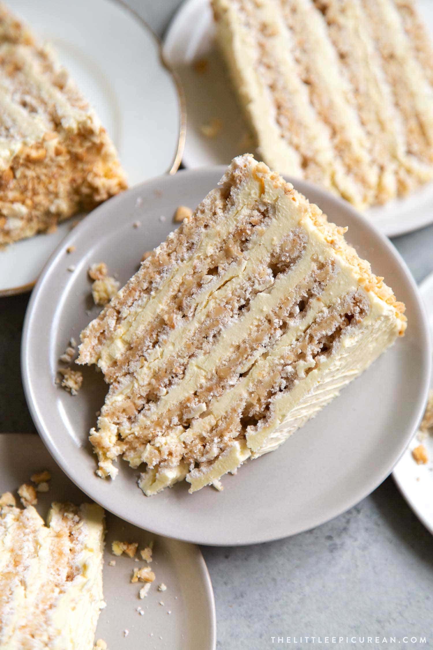 Sans Rival cake slice. Filipino cake consisting of cashew dacquoise layered with French buttercream. #cake #dessert #glutenfree #cashews #buttercream #filipino #filipinodesserts #filipinorecipes