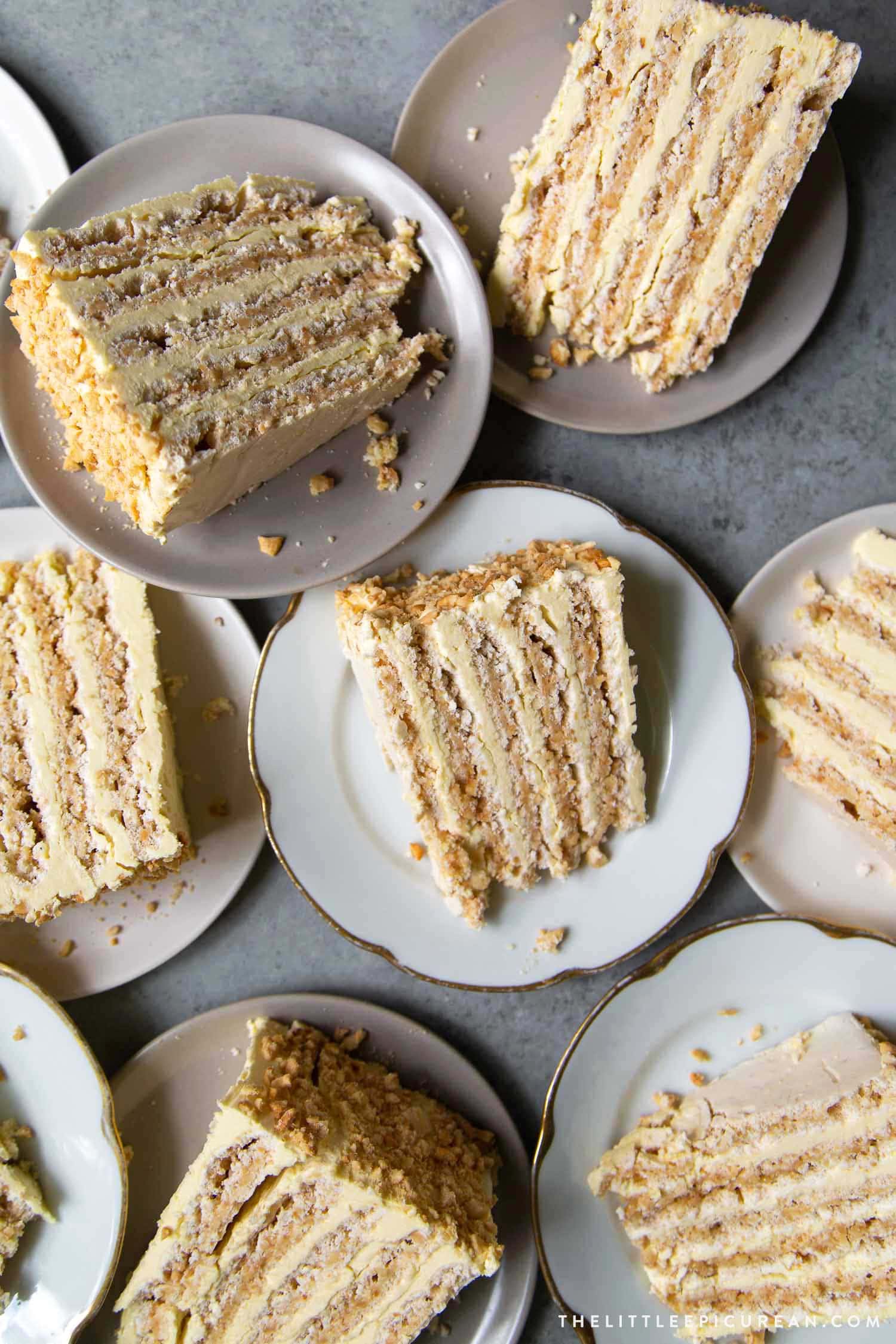 Sans Rival cake slice. Filipino cake consisting of cashew dacquoise layered with French buttercream. #cake #dessert #glutenfree #cashews #buttercream #filipino #filipinodesserts #filipinorecipes