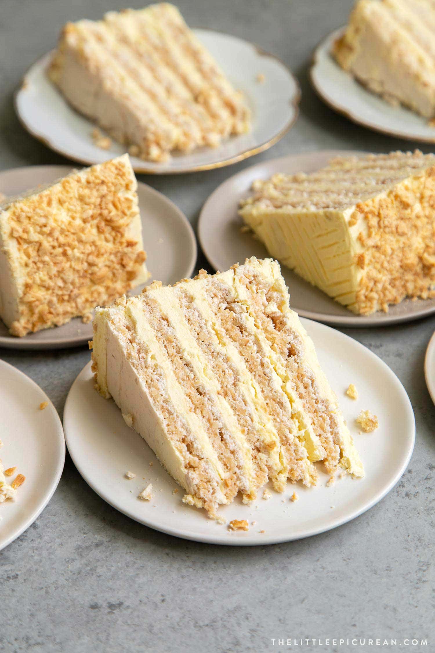 Sans Rival cake slice. Filipino cake consisting of cashew dacquoise layered with French buttercream. #cake #dessert #glutenfree #cashews #buttercream #filipino #filipinodesserts #filipinorecipes
