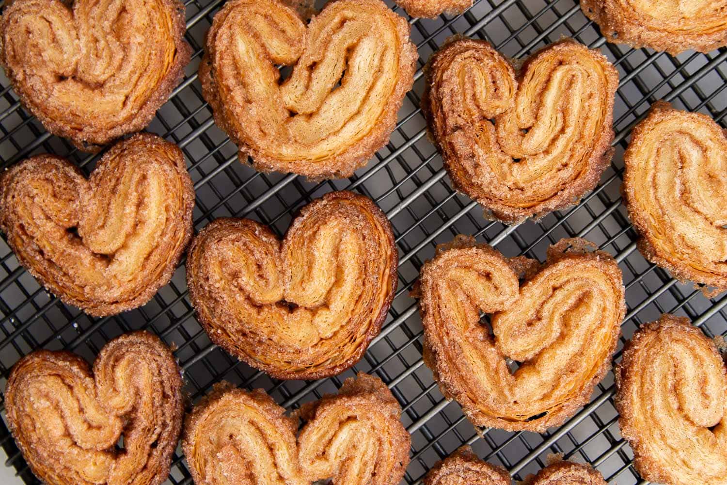 Cinnamon Sugar Palmier. These crispy mini cookies are made with puff pastry. They're super easy to assemble! #palmier #cookies #cinnamonsugar #easyrecipe #dessert