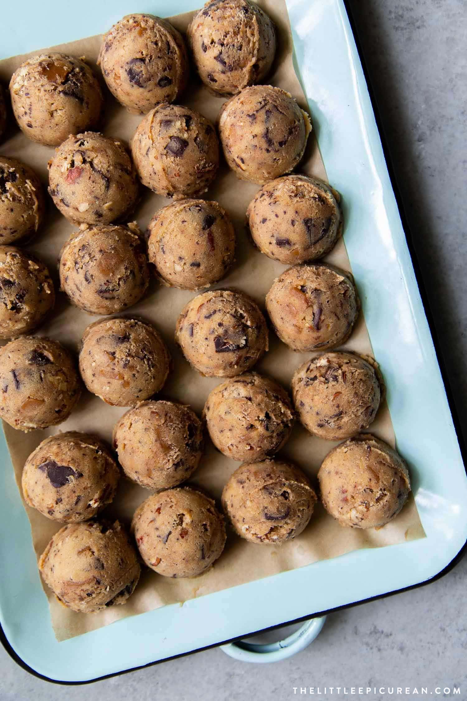 Cookie dough mixed with homemade toffee bits, toasted pecans, and chocolate chunks. This cookie dough can be made ahead of time and kept frozen for up to a month. #cookies #holidaycookies #chocolatechipcookies #cookierecipe #dessert