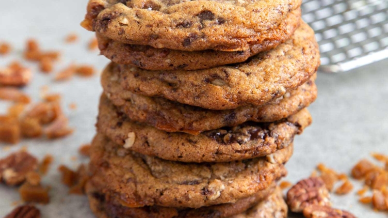 Pecan Toffee Chocolate Chunk Cookies. These soft and chewy cookies are loaded with flavor. They remain chewy even days after baking! #cookies #holidaycookies #cookieexchange #recipe #chocolate #toffee #dessert