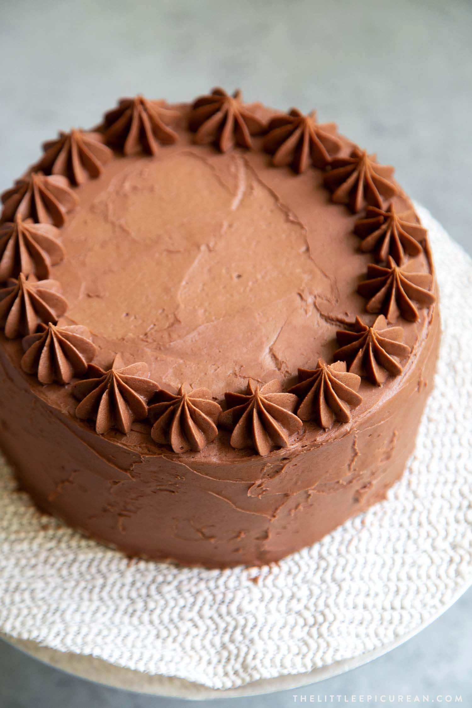 Classic Chocolate Cake with chocolate American buttercream and piped border