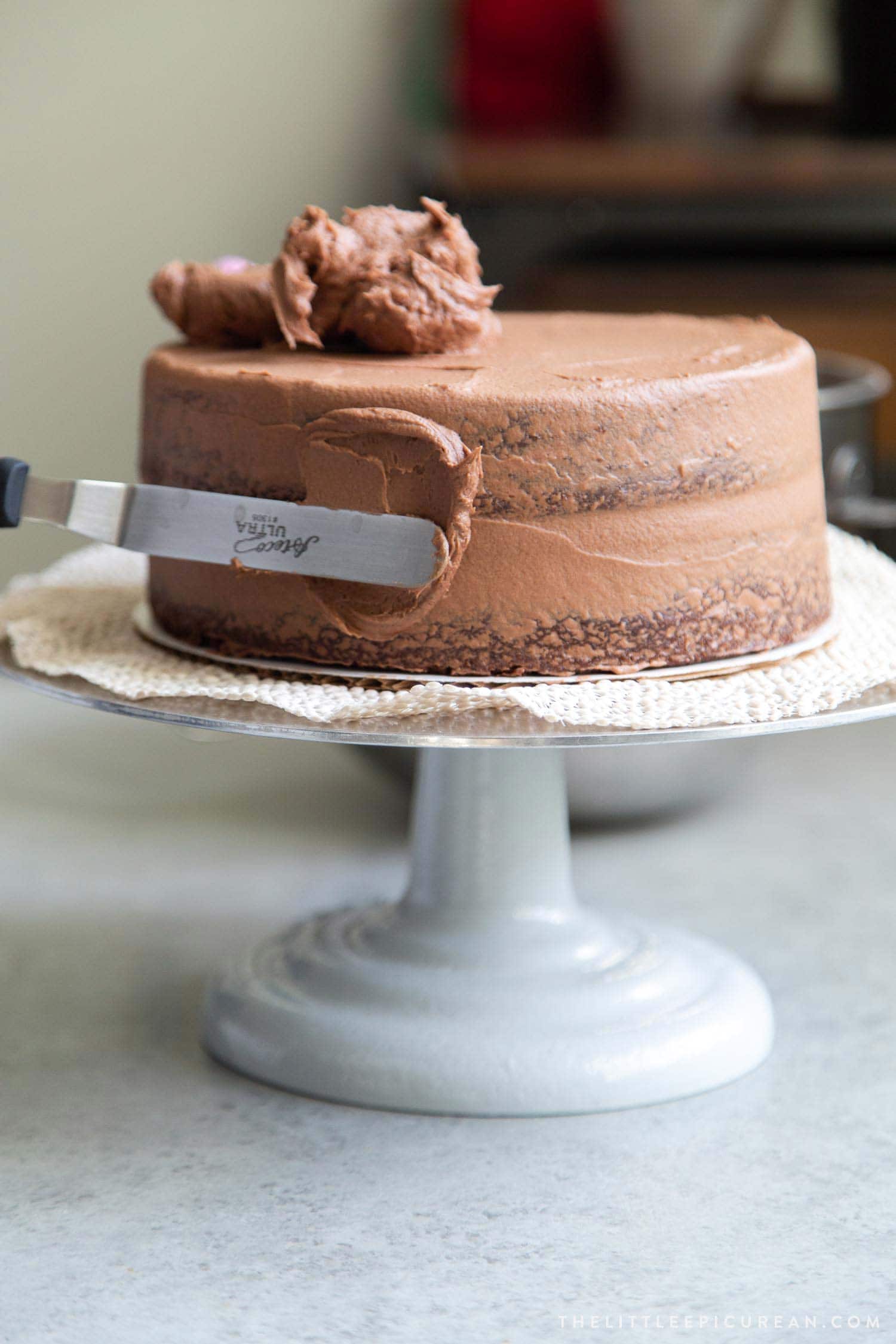 Classic Chocolate Cake. Cake gets second coat of buttercream after crumb coat.