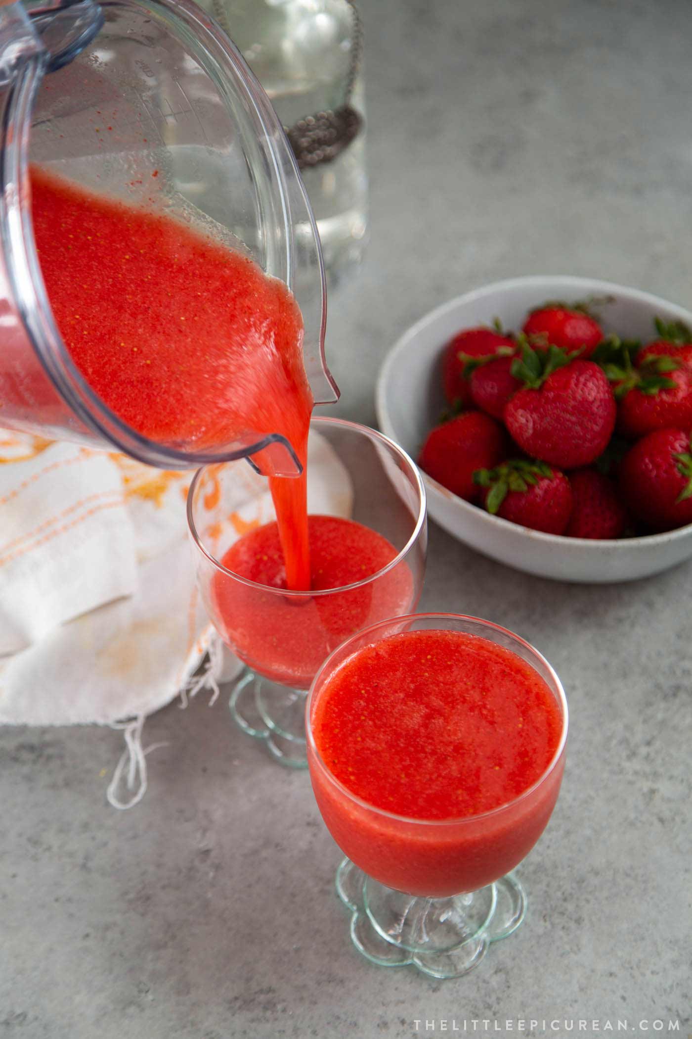 Pour blended frozen strawberry daiquiri into serving glasses and enjoy immediately