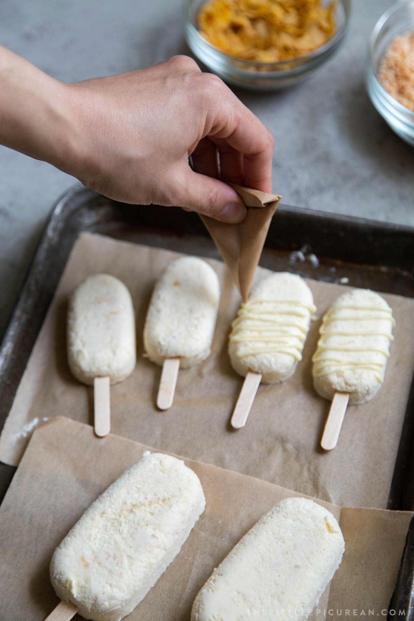 Corn ice cream bars drizzled with melted white chocolate