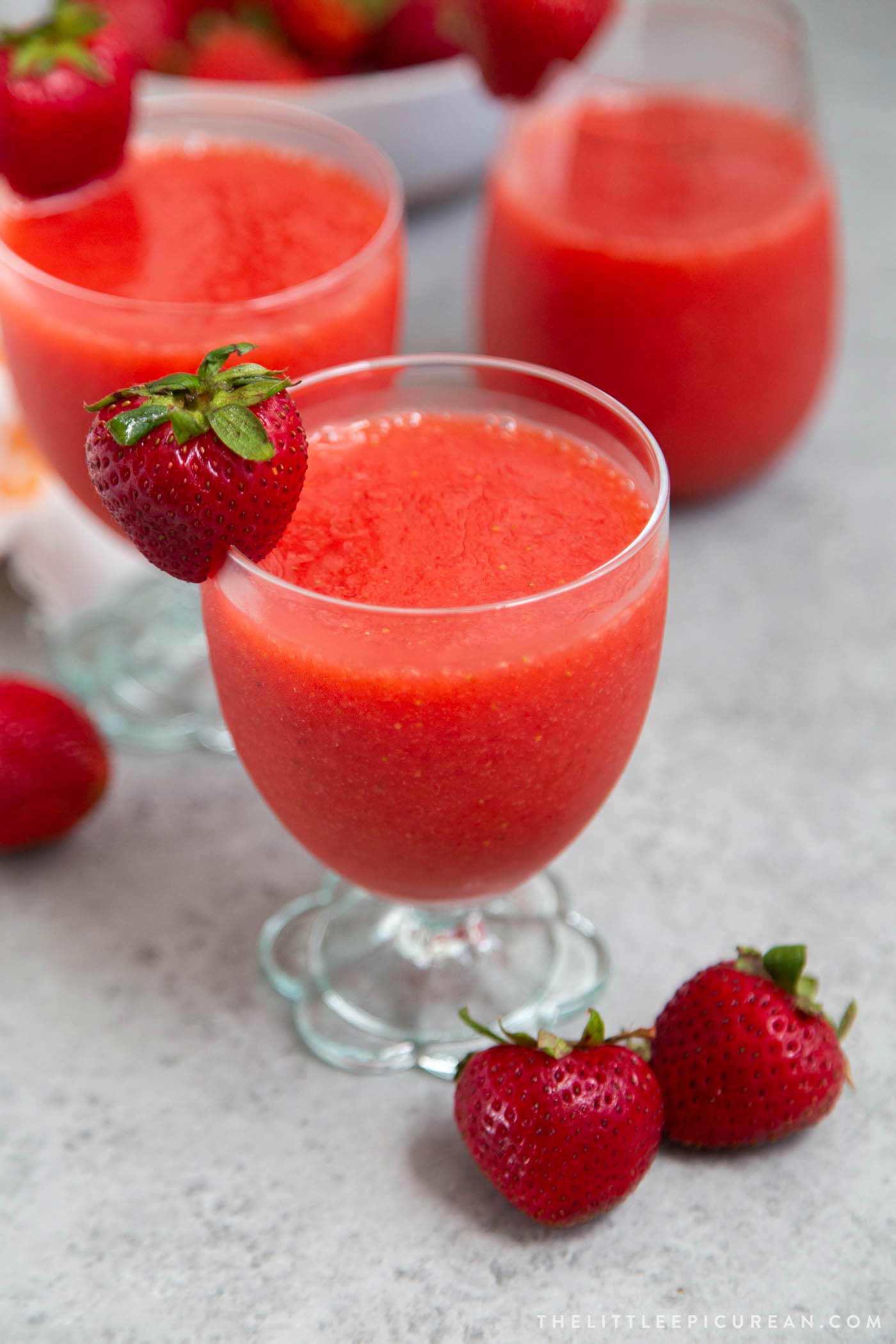 Frozen strawberry daiquiri made with frozen strawberries, light rum, lime juice, and simple syrup