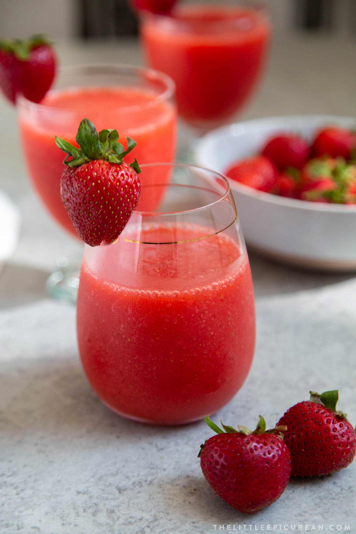 Frozen strawberry daiquiri made with frozen strawberries, light rum, lime juice, and simple syrup