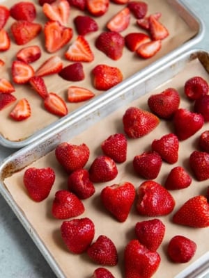 Place hulled strawberries on sheet tray