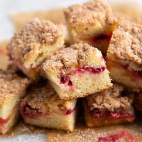 Plumcot Crumb Cake featuring vanilla cake with sliced plumcots and spiced crumble topping