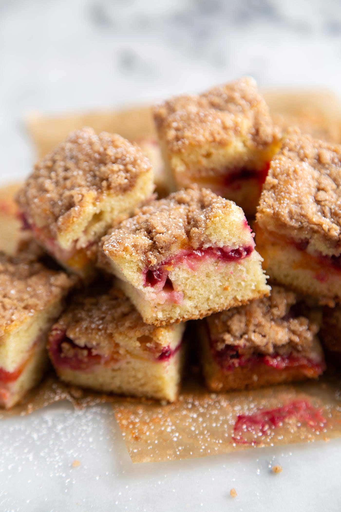 Plumcot Crumb Cake featuring vanilla cake with sliced plumcots and spiced crumble topping