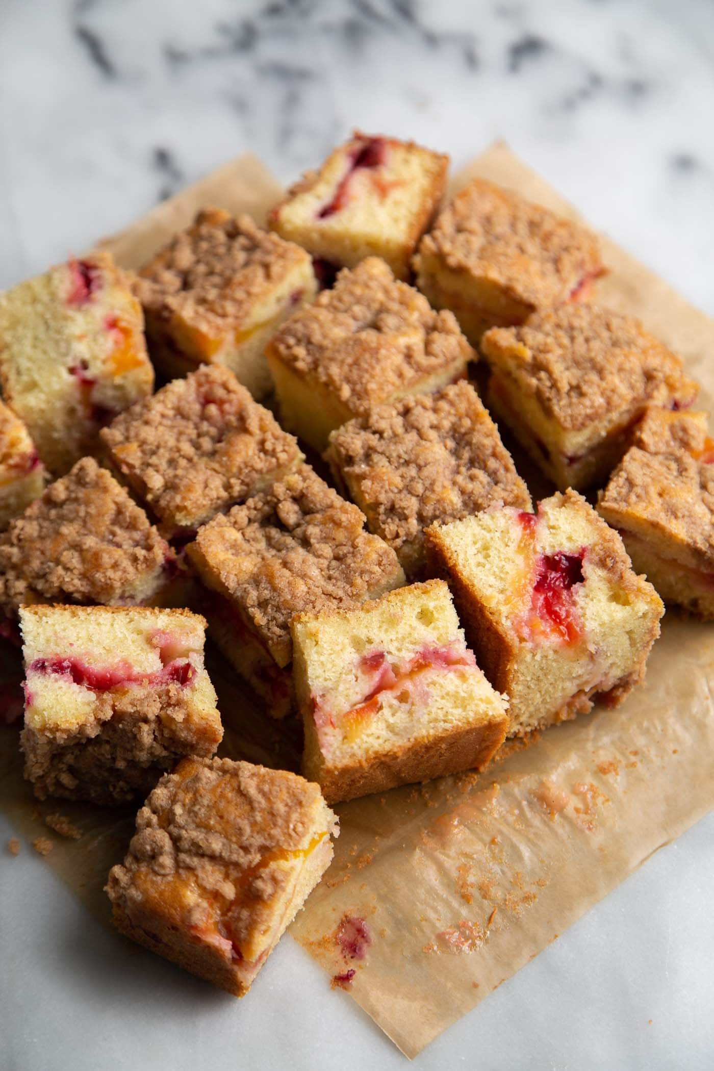Plumcot Crumb Cake featuring vanilla cake with sliced plumcots and spiced crumble topping