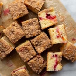 Plumcot Crumb Cake featuring vanilla cake with sliced plumcots and spiced crumble topping