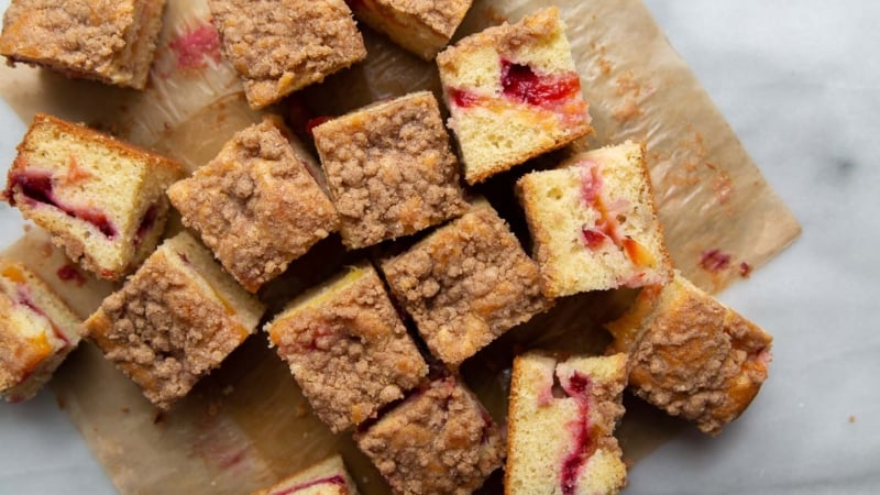 Plumcot Crumb Cake featuring vanilla cake with sliced plumcots and spiced crumble topping