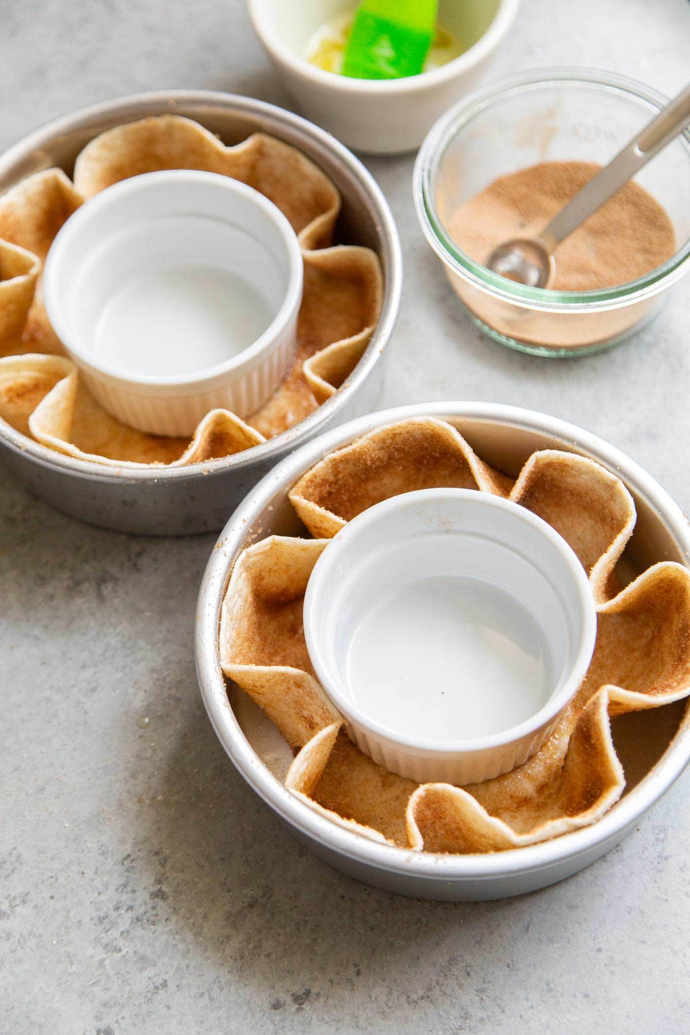 assemble dessert tortilla bowl in cake pan for baking. 