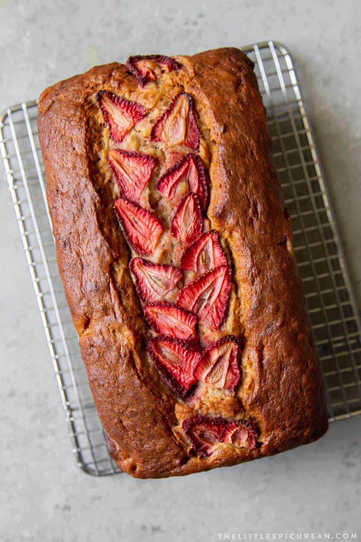 strawberry banana bread on wire rack. 