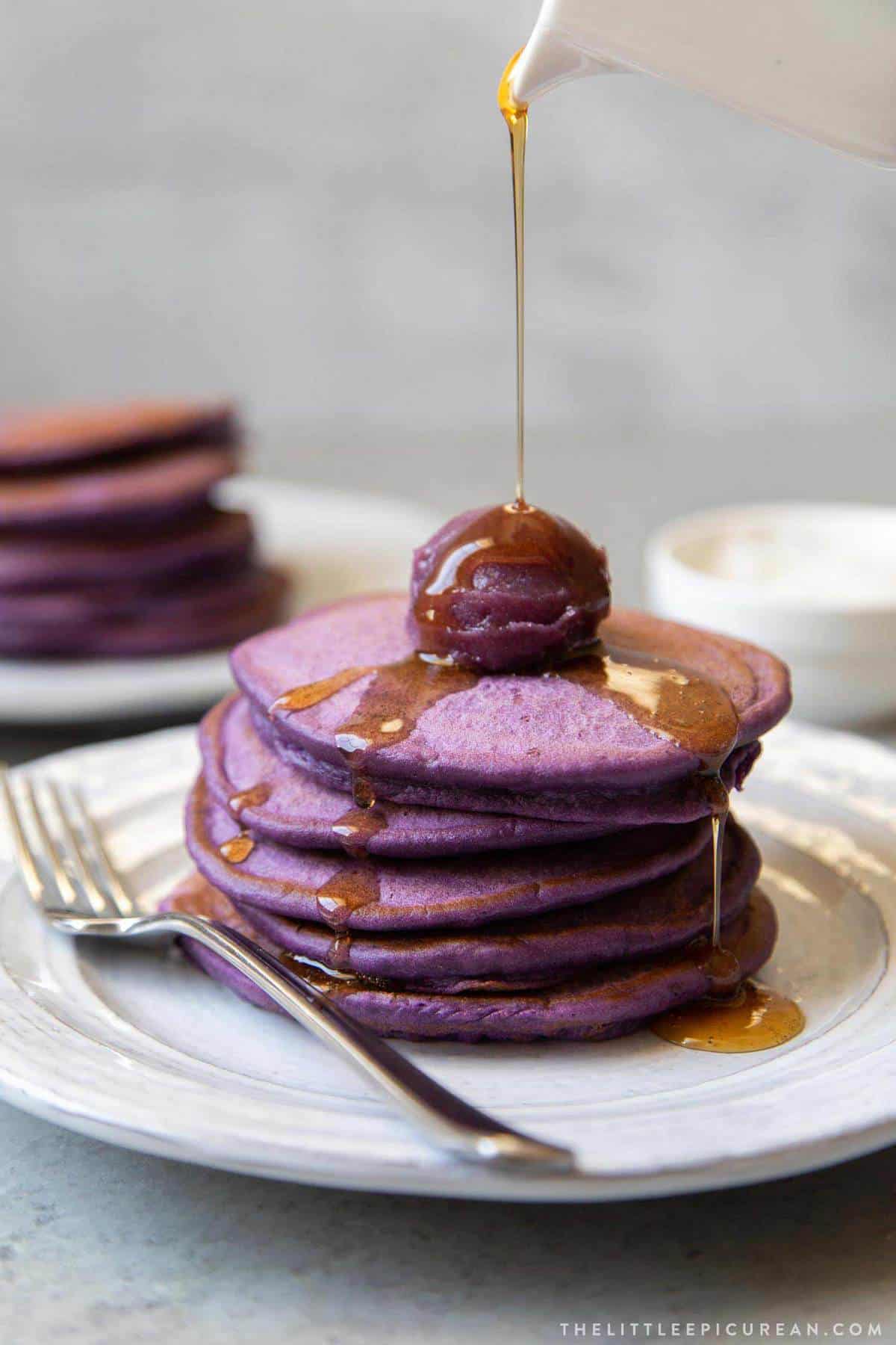ube pancakes with ube halaya and maple syrup