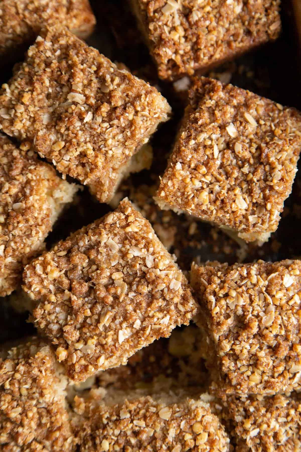 sliced portions of apple coffee cake with crumble topping