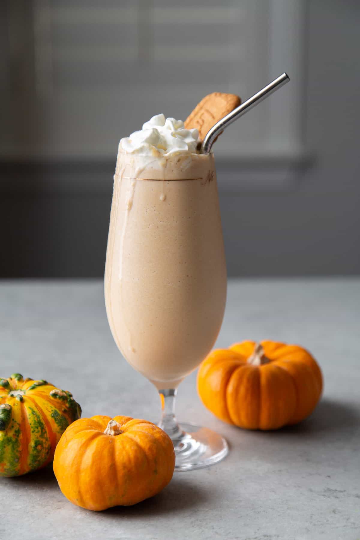 Pumpkin Milkshake topped with whipped cream and biscoff cookie