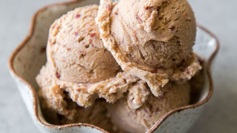 3 scoops of red bean ice cream in a white bowl.