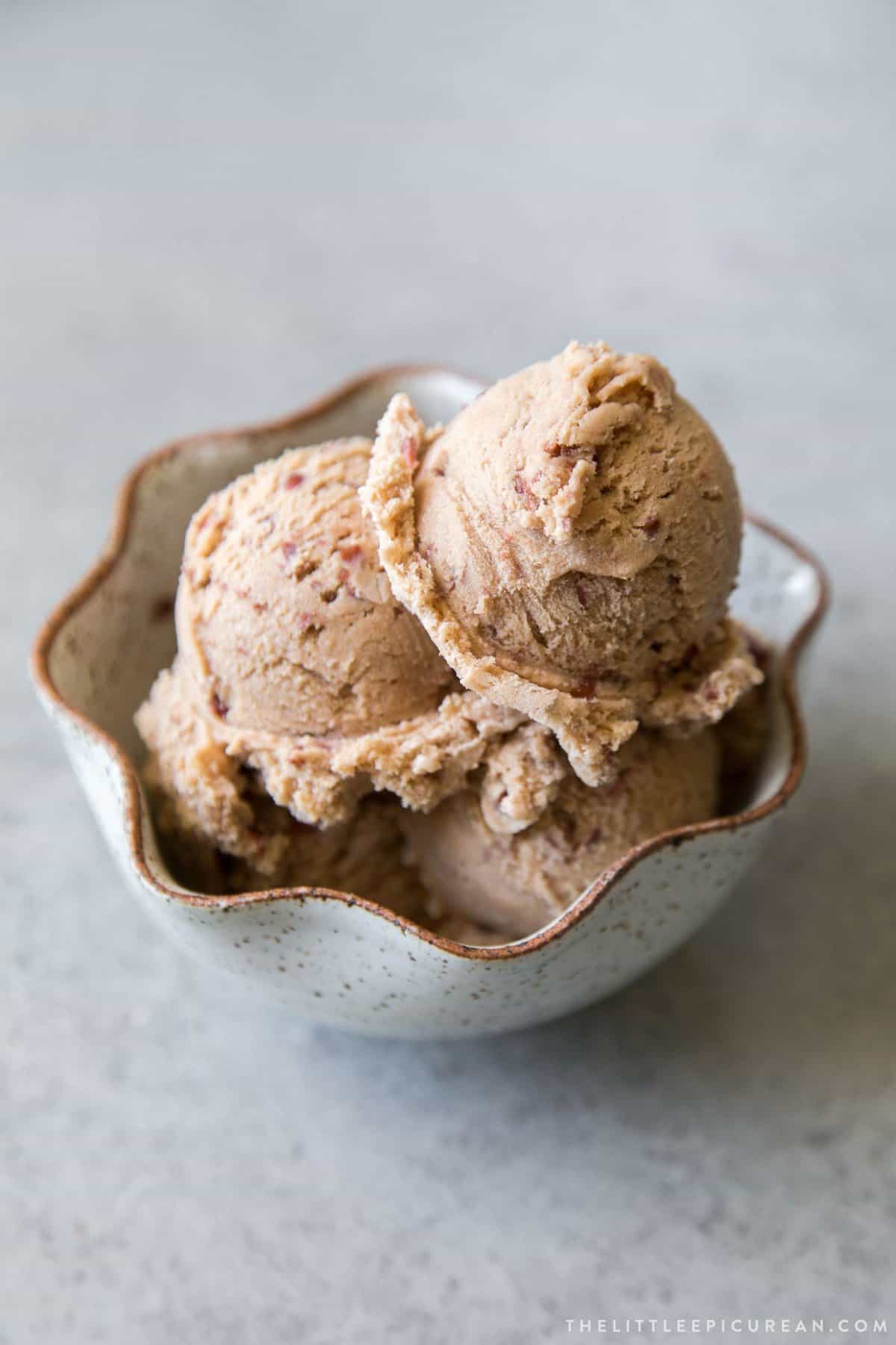 3 scoops of red bean ice cream in a white bowl.