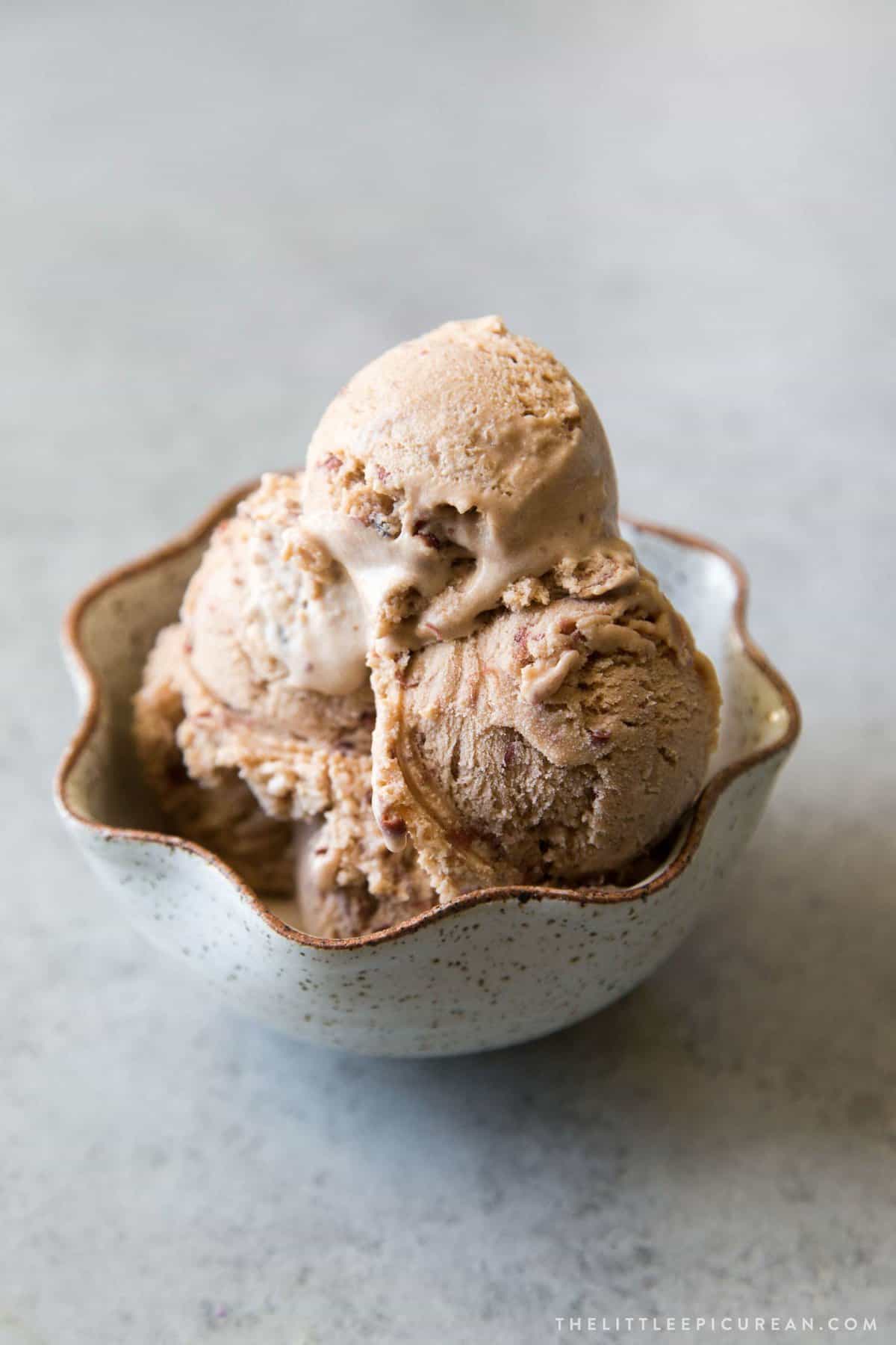 several scoops of red bean ice cream served in fluted bowl.