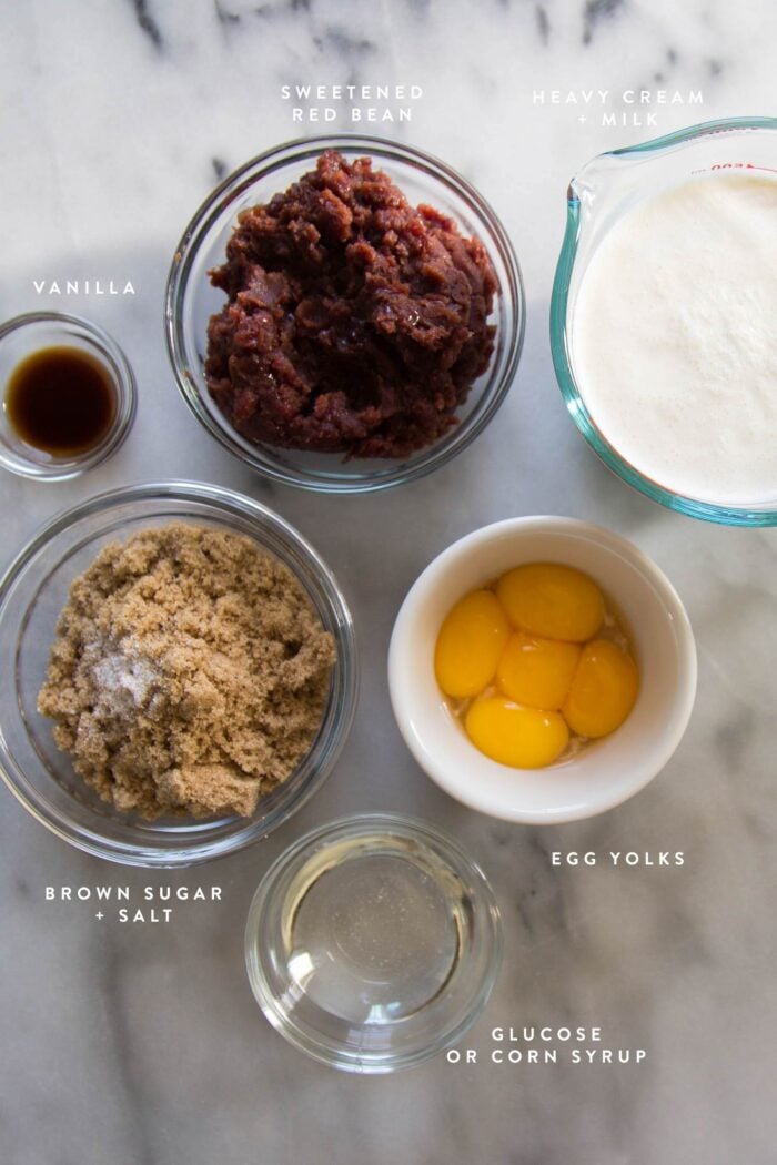 overhead shot of ingredients needed to make red bean ice cream including red bean paste and egg yolks.