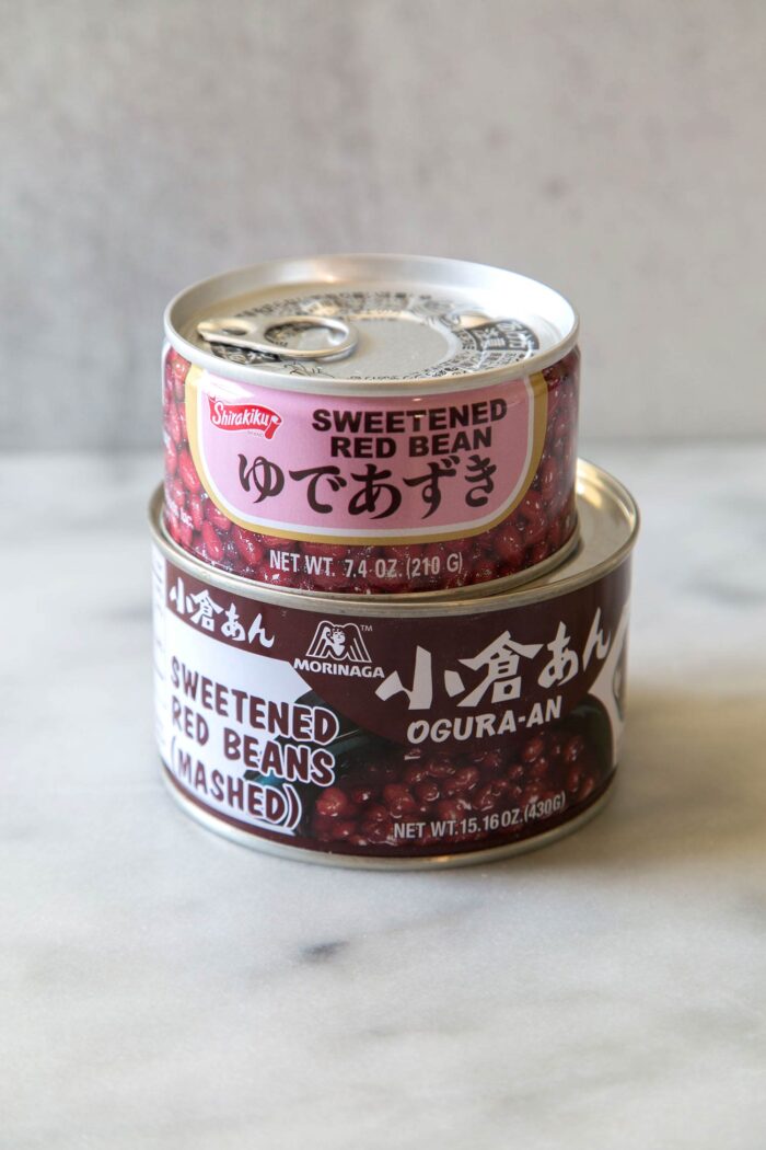 two different cans of prepared red beans.