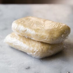 double crust pie dough wrapped in plastic.