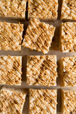 Biscoff Rice Krispies Treats Squares drizzled with melted cookie butter.