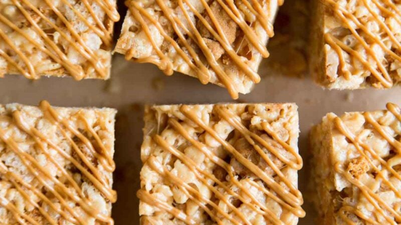 Biscoff Rice Krispies Treats Squares drizzled with melted cookie butter.