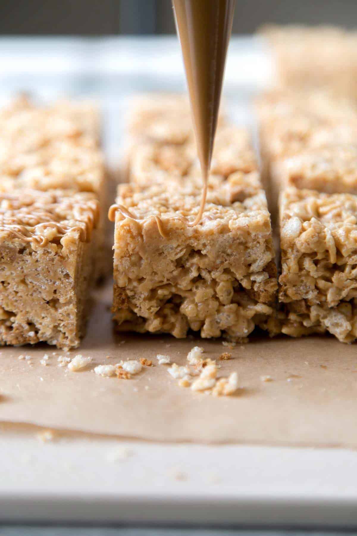 top biscoff rice krispies treats with melted cookie butter.