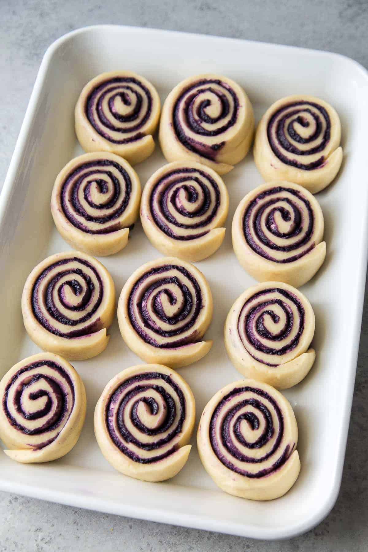 ube bread rolls after proofing.