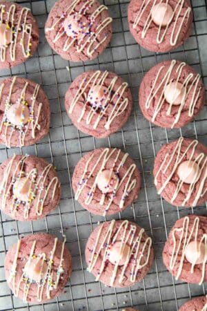 strawberry cookies topped with strawberry kiss chocolate and white chocolate drizzle.