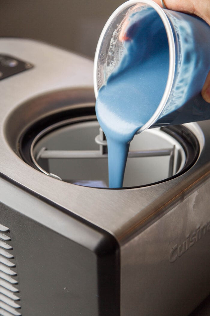 blue ice cream poured into compressor ice cream machine.