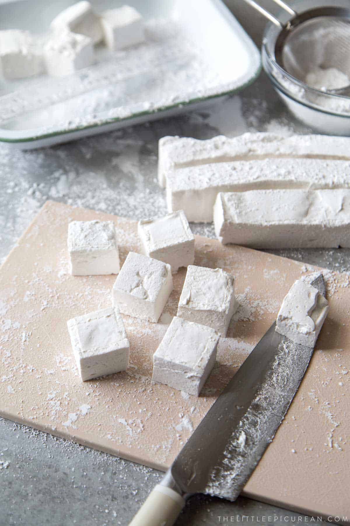 cut marshmallows with oiled knife and toss in confectioners sugar.