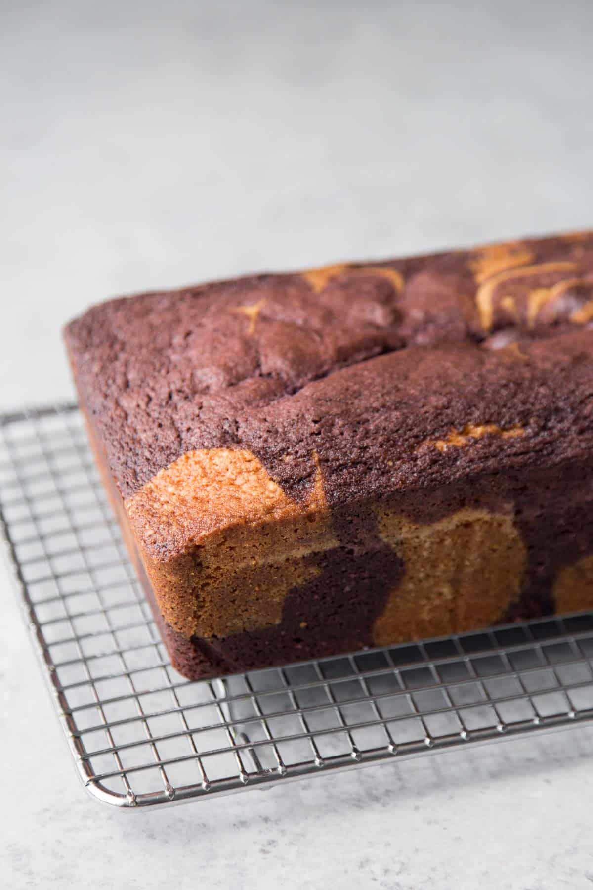 baked ube pound cake on wire rack. 