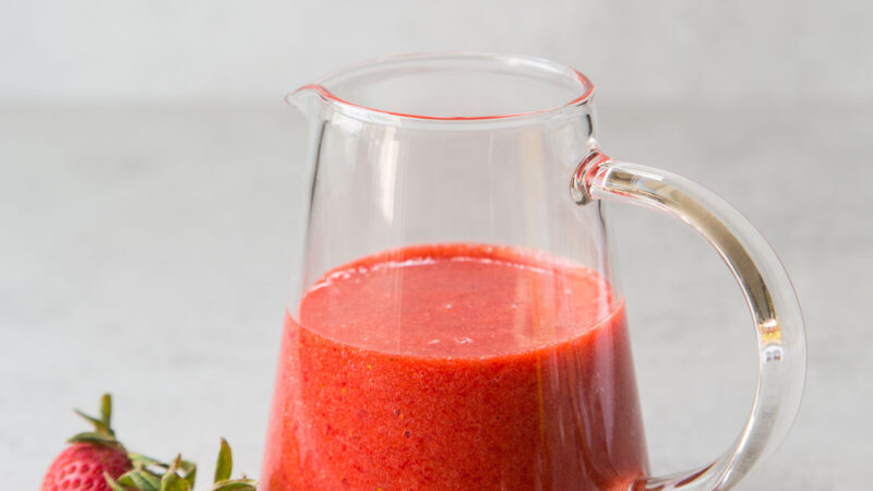 fresh strawberry sauce in spouted container.