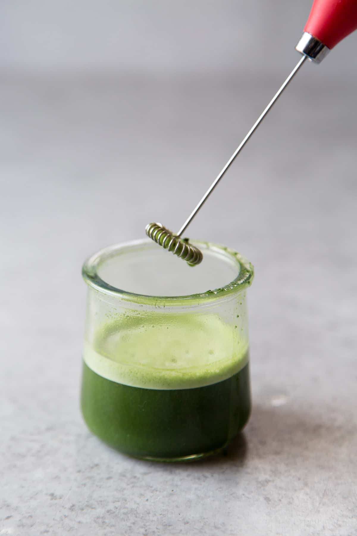 matcha prepared with hot water and electric milk frother.