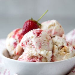 close up of strawberry cheesecake ice cream with fresh strawberry.