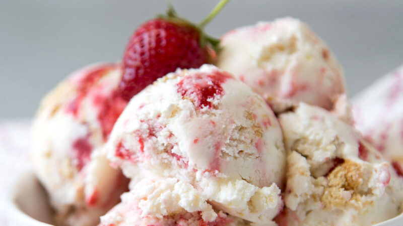 close up of strawberry cheesecake ice cream with fresh strawberry.